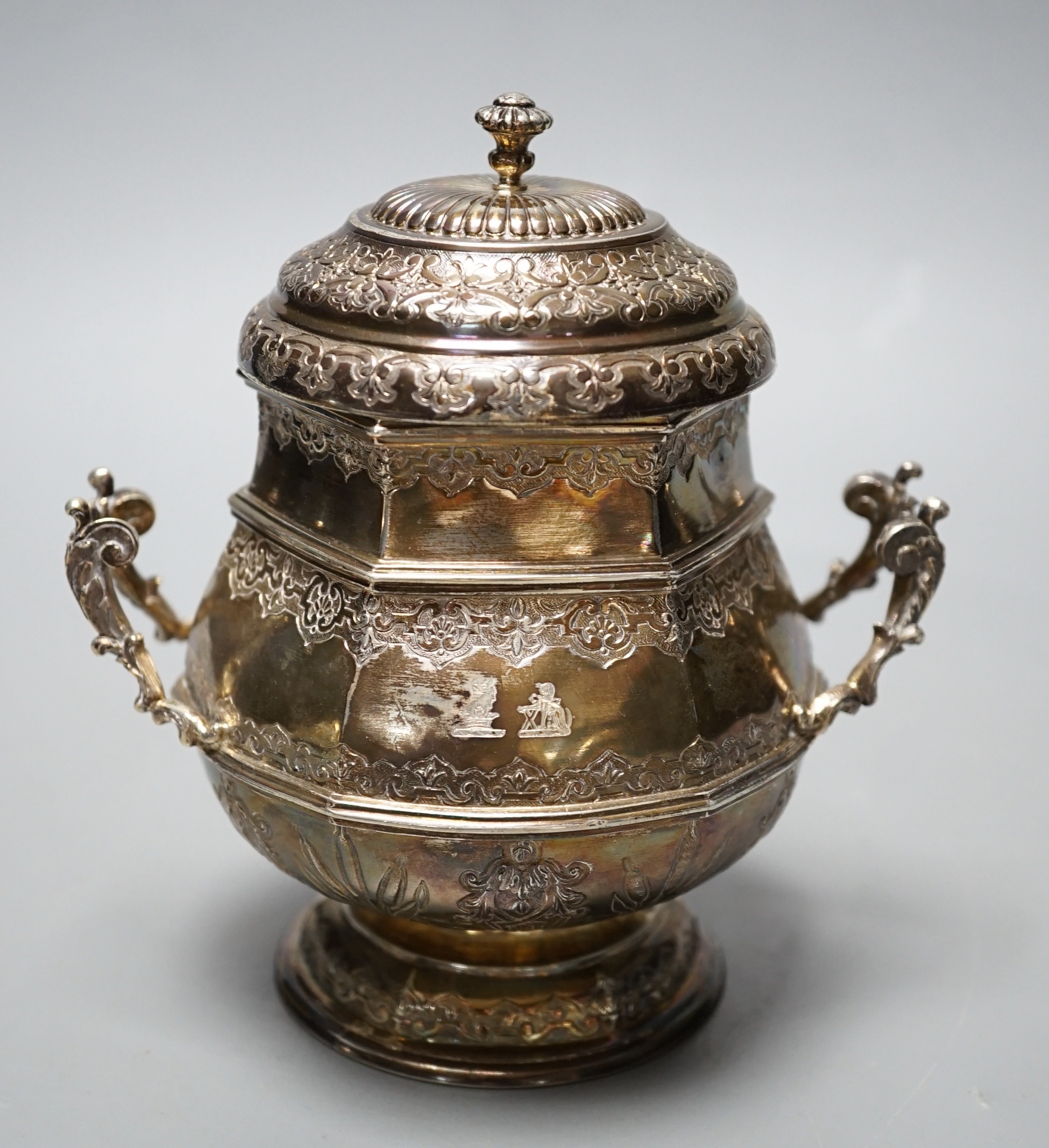 A French silver two handled hexagonal sugar bowl and cover, with London import marks for 1957, height 14.2cm, 12oz.